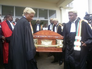 Colleagues take out the casket of Justice Mwambo from the Buea Hospital Mortuary 