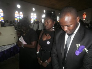 The Ewunkem children and their mother in church during funeral mass in honour of their fallen dad & husband