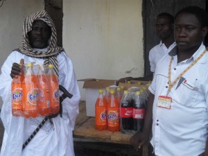 The Imam of Muyuka brandishes a pack of Fanta received from the Chief of Sector, Muyuka, Achille Boniface Ndi after the morning prayers session. 