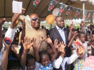 The DO of Dibombari (in glasses), Boniface Tene & the Mayor, Chief Frederic Nguime Ekollo commune with the children of Dibombari 