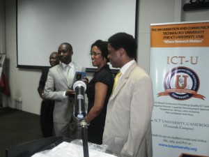 Dr Heidi Williams (2nd from right) from the USA presents an award to Zimbabwe's Minister of ICT, Nelson Chamisa ...