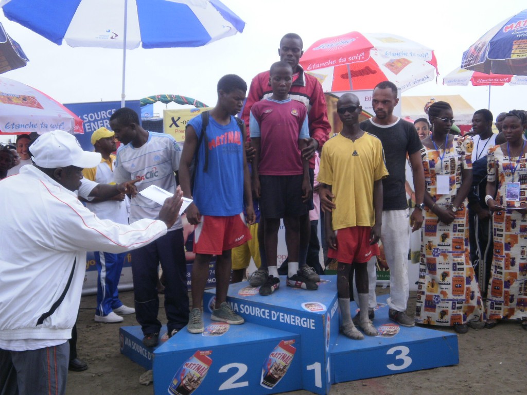 Winners of the Blind category and their guides mount the podium for their prizes