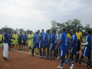 Dream Soccer and Junior Veteran players shake hands