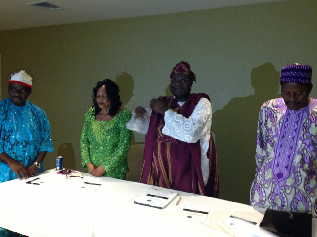 Convention Chair, Dr Elliot Obi-Tabot in white lace and Out Going AO, Dr Ashu Samuel in blue and NOMA Board Chair, Steve Bate. Mrs. Antonia Ojongtambia