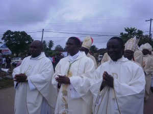 Coadjutor elect Mgr Nkea (middle) being accompanied by fellow priests during the procession