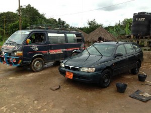 Two vehicles in Foundation Car Wash Mile 2, Mamfe, Cameroon