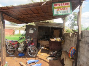 Amos Obinyikefor at work at his motorcycle mechanic shop