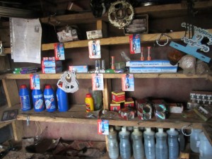 Spare parts on shelves at Amos motorcycle mechanic shop