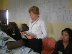 A Cameroon woman reads out some suggestions on how to get access into the decision-making processes